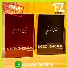 two perfume boxes sitting on top of a wooden table next to another box with the words dolce garbana