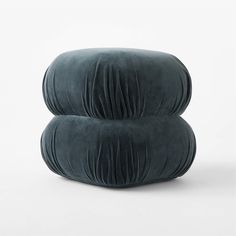 two pillows sitting on top of each other