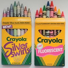 two boxes of crayola silver and fluorescent colored crayons next to each other