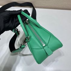 SHOP MORE LUXURY PRODUCTS HERE Description Prada Triangle Bag Green For Women, Women’s Bags 9.8in/25cm 1BB082_2BYA_F0458_V_NEO This soft bag reinvents in an innovative way the classic and sophisticated shape of the top-handle bag, transforming it into a versatile, sporty design. The accessory with double handle and detachable logo-print woven tape shoulder strap can be worn in different ways and is decorated with a modern interpretation of the lettering logo appearing as an embossed detail Designer Green Handheld Bag, Designer Handheld Business Shoulder Bag, Designer Green Satchel With Top Carry Handle, Designer Green Shoulder Bag With Handles, High-end Green Shoulder Bag With Top Carry Handle, Designer Green Satchel For Daily Use, Designer Green Satchel With Detachable Handle, Designer Satchel With Zipper Closure, High-end Green Satchel With Detachable Handle