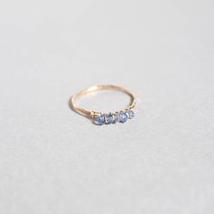 This ring features 5 natural tanzanite gemstones wire wrapped on a 14k gold filled/sterling silver band. Each ring is about 1mm thick with a hammered texture. Pearl Engagement Ring Set, Wrapped Crystal Ring, Wire Crown, Gemstone Stacking Ring, Wire Wrapped Crystal, Pearl Engagement Ring, Ring Wire