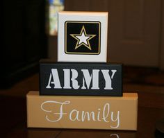 a wooden block with the words army on it and a star in the middle that says family