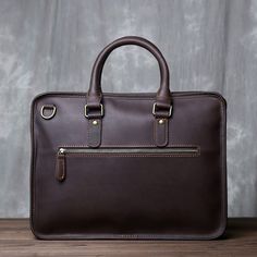 The Retro Horse Handbag is a premium quality, a multifunctional leather bag designed to serve as a briefcase or handbag. It is made of first-layer leather, which is known for its durability, strength, and texture. The bag has a rich brown color that gives it a vintage, retro look, making it perfect for use in various settings, including business, casual, or formal occasions. The Premium Briefcase has a spacious interior that can accommodate multiple items, such as laptops, documents, books, tabl Luxury Leather-backed Formal Briefcase, Large Capacity Leather Briefcase For On-the-go, Rectangular Briefcase With Leather Backing For On-the-go, Vintage Brown Leather-lined Briefcase, Vintage Brown Leather Briefcase, Rectangular, Leather Bag Design, Brown Coffee, Have Metal, Retro Look