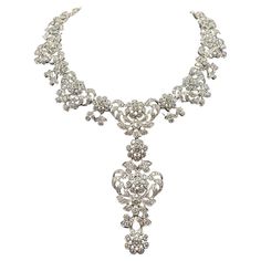 Elevate your jewelry collection with this exquisite Edwardian diamond necklace, meticulously crafted from 18-kt white gold. This custom vintage piece boasts an impressive 35.97-carats of diamonds, radiating timeless elegance and sophistication. The necklace features a detachable centerpiece pendant, allowing versatile styling options to suit any ensemble. Luxury Elegant Filigree Diamond Necklace, Luxury White Gold Diamond Necklace With Intricate Design, Opulent Diamond Necklace For Formal Events, Opulent Diamond Necklace For Formal Occasions, Silver Platinum Bridal Necklace With Single Cut Diamonds, Silver Bridal Necklace With Single Cut Diamonds In Platinum, Exquisite Diamond Necklace With 17 Jewels For Evening, Wedding Rose Cut Diamond Platinum Necklace, Opulent Diamond Necklace With 17 Jewels