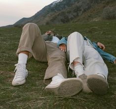 a person laying on the ground with their feet up