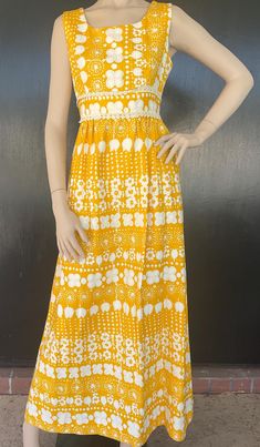 Late 1960s early 1970s Alex Colman maxi dress. Yellow and white lightly ribbed texture cotton. White decoration around fitted empire waist. Nylon zip back. Measurements  34" bust 26" waist 54" hips 14" bodice length 55" length Sweet dress shows very well with minimal to no wear. 1970s Style White Maxi Dress, Retro Yellow Maxi Dress, Vintage White Sleeveless Maxi Dress, Retro White Maxi Dress For Spring, Retro Yellow Maxi Dress For Spring, Yellow Retro Maxi Dress For Spring, 1970s White Maxi Length Dresses, 1970s White Maxi Dress, Yellow Retro Maxi Dress