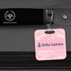 • PREMIUM QUALITY MATERIAL: Delta Gamma Custom Made Square Bag Tag is made from high-quality White Gloss FRP, Fiberglass Reinforced Plastic. • DIMENSIONS: The luggage tag measures 3” H x 3” W. • IMPECCABLE GRAPHICS: Delta Gamma Square Bag Tag features custom graphics along with the logo, motto, and the name of Delta Gamma. • PERFECT: Delta Gamma is the perfect accessory for any bag! Durable elastic strap easily attaches to baggage and keeps bag tag securely fastened en route. • SAFETY AND USAGE Delta Gamma Designs, Acacia Fraternity, Delta Gamma, Luggage Bag, Custom Graphics, Bag Tag, White Gloss, Fraternity, Luggage Tag