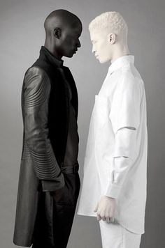 two men standing next to each other in front of a gray background with text that reads, the lightest and darkest skin color human diversity is amazing