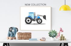 a blue tractor is on the wall above a white table