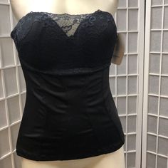 This Black Bandeau Bra From F.I.T Is Perfect For Women Who Want To Feel Comfortable And Elegant At The Same Time. The Bra Is Designed With A Solid Pattern And Features A Strapless Design Ideal For Wearing Under Any Outfit. It Comes In Size L And Has A Tummy Control Feature That Flatters Your Figure. The Bra Is Made Of A Fabric Blend Containing Polyester And Spandex. The Lace And Clasps Of The Bra Add A Touch Of Elegance To Your Look. This F.I.T Bra Is Perfect For Any Occasion And Can Be Worn Wit Elegant Tops With Built-in Bra, Elegant Underbust Top For Night Out, Fitted Evening Tops With Removable Bra Pads, Elegant Underbust Tops, Elegant Party Corset, Bra Friendly, Underbust Tops With Built-in Bra For Night Out, Elegant Camisole Top With Removable Bra Pads, Elegant Lined Body Corset For Night Out, Elegant Lined Corset For Night Out