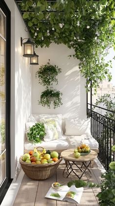 an outdoor living area with wicker furniture and potted plants on the wall above