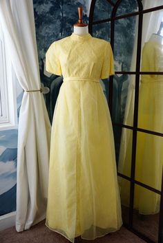 Beautiful full length canary yellow gown. The material consists of both lace, and chiffon. It has a zipper back and has a small stain, that is shown on the last photo of the listing. Other than that, it is in excellent condition. Measurements (lying flat) Waist: 14 in. Pit to pit: 16.5 in. Length : 54 in. Yellow Summer Prom Gown, Yellow Organza Wedding Dress, Yellow Organza Evening Dress, Yellow Floor-length Gown For Summer, Yellow Floor-length Summer Gown, Fitted Yellow Sheer Dress, Yellow Fitted Sheer Dress, Yellow Lace Maxi Dress For Party, Yellow Short Sleeve Maxi Dress For Evening