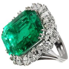 Magnificent Natural Colombian Emerald, weighing approximately 25 carats, set in a custom hand crafted 18 karat white gold mounting. Triple prong set at each corner secure this center gem and it is surrounded by 25 marquise cut and pear shape bright, white diamonds, with a total approximate weight of 5 carats which crea Emerald Rings, Emerald Diamond Ring, Colombian Emeralds, Diamond Cocktail Rings, Antique Engagement, Antique Engagement Rings, Emerald Jewelry, White Gold Ring, Emerald Diamond