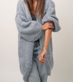 This long cardigan is handknitted with premium quality Kid Mohair. A luxury yarn made out of 80% kid mohair; 10% Lana merino extra fine; 10% Polyamide. Very light and fluffy feeling. Designed to flatter all silhouettes with its wide oversized fit. Perfect for casual, dating, office, going out, party and formal events.  Available in different colors - please visit my Etsy shop. SIZE & FIT One size fit (XS - L) / EUR (34-40) / US (4-10) / CANADA (6-12) / UK (8-14) Wide fit, open front Ribbed wrist Mohair Cardigan With Soft Texture For Winter, Hand Knitted Mohair Cardigan, Winter Mohair Cardigan, Hand Knitted Mohair Cardigan For Winter, Winter Mohair Cardigan With Soft Texture, Cozy Mohair Sweater Coat With Chunky Knit, Hand Knitted Mohair Outerwear, Cozy Knitted Mohair Cardigan, Cozy Mohair Cardigan