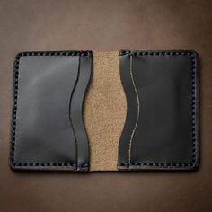 A Leather Wallet that goes Above and Beyond Your Expectations.When you hold this wallet you will love the supple and comfortable feel. Unlike most department store wallets, our leather features premium Horween leather, thick hand-stitching, and polished edges. Every inch of our craftsmanship has a high level of attention to detail. We build wallets to last a lifetime - and guarantee it.Our full-grain Horween leather means your wallet will develop character and patina. We hand-sew this wallet wit Black Leather Rectangular Wallet, Black Leather Wallet For Daily Use, Black Bifold Wallet With Interior Card Slots, Everyday Black Trifold Wallet With Smooth Grain, Leather Card Holder With Coin Pocket For Everyday Use, Black Leather Wallet As Gift, Black Wallets With Card Slots For Everyday, Black Leather Trifold Wallet For Everyday, Black Wallets With Card Slots For Everyday Carry