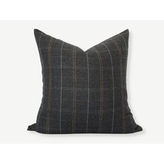 a black and grey pillow with a brown stripe on it