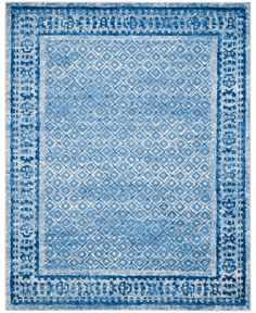 a blue and white rug with an intricate design