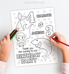 a child's hand holding a pencil and drawing a birthday card