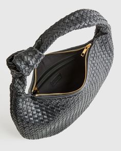 This Italian Leather Handwoven Slouchy Shoulder Bag is the epitome of luxury and style. Handcrafted from the finest Italian leather, this bag features a clean handwoven design that adds a touch of sophistication to any outfit. The slouchy silhouette gives it a relaxed and effortless vibe, perfect for everyday use or special occasions. With ample space and two pockets for all your essentials, this shoulder bag is both practical and chic. Make a statement with this versatile piece that will elevat Sheep Leather, Quince, Leather Working, Corporate Gifts, Italian Leather, Zip Pockets, Dust Bag, Hand Weaving, Shoulder Bag