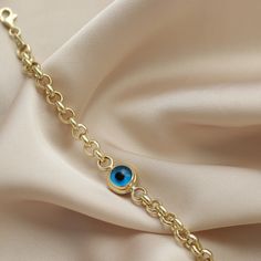 "Ⓜ14 K Gold Rolo Doc Evil Eye Bracelet Charm Chain Hoop Birthdays Gift For Women Luck Blue Gold Jewelry Design Handmade Dainty ⓂEvil Eye Bead Bracelet People have used Evil Eye Bead to avoid bad looks since long time. You can give a gift to the people you cared who dazzle with their beauty and want to be protected from the evil eye. This Evil Eye Bead Bracelet symbolizes grace and elegance. We designed this bracelet for you beautiful women who are always loved and do not compromise on their eleg Elegant Evil Eye Bracelet With Adjustable Chain Gift, Elegant Round Chain Bracelet With Evil Eye, Elegant Round Evil Eye Chain Bracelet, Gold-tone 14k Gold Chain Bracelet As Gift, 14k Gold-tone Chain Bracelet As Gift, Elegant Gold-plated Evil Eye Bracelet, Elegant Gold Charm Bracelet With Birthstone, Elegant Yellow Gold Evil Eye Bracelet Gift, Elegant Blue Chain Bracelet As Gift