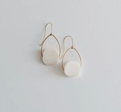 White bone beads on hand-shaped brass arches with brass ear hooks. (1” x 1.75”) Bone Beads, Ear Hook, Bones, Dangle Earrings, Brass, Beads, White