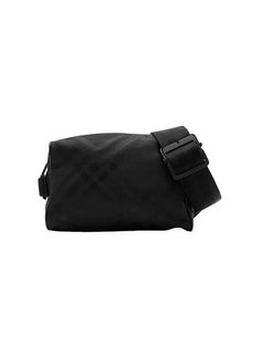 This Burberry belt bag features a signature jacquard-woven check pattern. The compact design is trimmed with leather and features B-cut hardware, an adjustable webbing strap, and a zip closure..Adjustable belt strap.Interior: two compartments.Side adjusters.Top zip closure.Polyamide.Lining: polyamide.Trim: leather.Imported.SIZE.About 9'W x 6'H x 3.9'D.Belt strap: about 11.8' - 47.2' drop.ABOUT THE BRAND.Founded in 1856 by 21-year-old Thomas Burberry, the brand set out with a mission to stylishly Luxury Business Shoulder Bag With Removable Belt, Luxury Shoulder Bag With Removable Belt For Business, Designer Business Belt Bag With Removable Belt, Designer Business Bags With Removable Belt, Designer Business Bag With Removable Belt, Designer Rectangular Bag With Belt Detail, Luxury Belted Crossbody Bags, Business Shoulder Bag With Removable Belt, Crossbody Style, Business Crossbody Shoulder Bag With Removable Belt