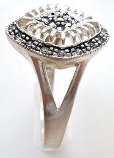 Fine Jewelry - This is a sterling silver marcasite and cubic zirconia ring with an open work design. It is hallmarked 925, face measures almost .75" by .63", is a size 10 and weighs is 4.4 grams. Silver Sterling Diamond Ring With Stone Setting, Silver Sterling Filigree Ring With Stone Setting, Vintage Silver Jewelry With Pave Setting, Silver Cluster Ring With Stone Setting For Anniversary, Marcasite Anniversary Rings Stamped 925, Sterling Silver Cluster Ring Stamped 925, Antique Silver Rings With Halo Setting, Sterling Silver Marcasite, Work Design