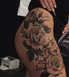 a woman's thigh with roses on it