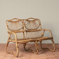 two wicker chairs sitting next to each other