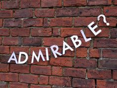 a brick wall that has the word'admarble'written in white on it