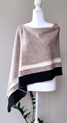 This nice beige colour with white and black stipes merino wool poncho is very elegant and is suited to complement different outfits, it is also suitable for weddings or other formal events in your life. It's the simplest way to add some colour and freshness to your wardrobe and stylize your everyday garments. A great gift for a loved one.    Knitted 100% merino wool ponchos. The poncho is available in one size. ❤️ Several wearing variants: as poncho, scarf, headgear, scarf, cape, vest and etc. ❤ Autumn Shawl, Scarf Cape, Poncho Scarf, Boho Caftan, Merino Wool Scarf, Wool Poncho, Beige Colour, Wool Wrap, Different Outfits