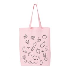 a pink tote bag with black drawings on the front and bottom, featuring vegetables