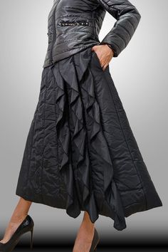 Fitted Nylon Tiered Skirt, Voluminous Long Skirt With Ruffles, Long Voluminous Ruffled Skirt, Winter Pleated Full Length Bottoms, Winter Stretch Lined Skirt, Winter Gathered Flared Skirt, Winter Long Skirt With Ruffles, Fitted Ruffled Skirt Bottoms For Winter, Winter Stretch Tiered Skirt Bottoms