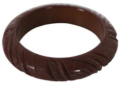 #31589 Early to mid 20th century brown Bakelite bangle bracelet carved with tiki or tribal inspired leaves and patterns. CONDITION Good Overall - Some embedded stains in grooves; see pictures DIMENSIONS 7.85" x 0.75" (Circumference x Width) Brown Bakelite Bangle Bracelet, Brown Carved Bangle Bracelets, Vintage Carved Brown Bracelets, Vintage Brown Carved Bracelets, Carved Brown Bangle Jewelry, Brown Carved Bangle Jewelry, Bakelite Bangles, Bangle Bracelet, Favorite Jewelry