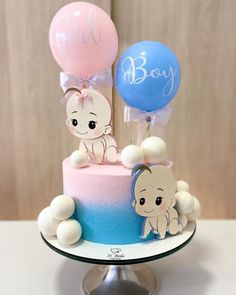 a baby shower cake with balloons on top