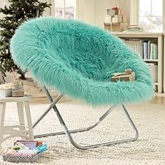 an image of a chair that is on the floor with a blue fur covering it