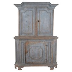 an old wooden cabinet with two doors