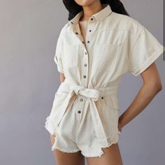 New With Tags Urban Outfitters Bdg Distressed Denim Romper Cream Color Size X Small Waist: 27" Inseam: 1.75" An Effortless Romper From Bdg. Cut Short. Button Placket At The Front. Finished With A Fabric Belt At The Waist And Distressed Hems. Chic Cotton Denim Jumpsuit With Relaxed Fit, Cotton Short Sleeve Denim Jumpsuit For Day Out, Short Sleeve Cotton Denim Jumpsuit For Day Out, Cotton Denim Jumpsuit With Short Sleeves For Day Out, Washed Cotton Denim Jumpsuit For Day Out, Cotton High-waisted Denim Jumpsuit For Day Out, Chic Cotton Button-up Denim Jumpsuit, High Waist Cotton Denim Jumpsuit For Day Out, High-waisted Cotton Denim Jumpsuit For Day Out