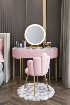 a pink vanity table with two chairs and a round mirror on it in a bedroom