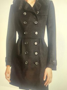 Add some luxury to your wardrobe with this stunning Burberry Trench Coat. Made with a wool and cashmere blend outer shell material, it features a solid black pattern and a button closure. The coat is a size 2 (US) and 36 (EU) and has a fur trim accent on the collar, adding a touch of elegance to the design. Perfect for the winter and fall seasons, this coat is a great addition to any fashionable woman's wardrobe. BEAUTIFUL NEW WITH TAGS FOX TRIM COAT RET,2.000 Designer Black Long Wool Coat, Designer Black Long Sleeve Wool Coat, Designer Black Wool Pea Coat, Elegant Black Long Peacoat, Burberry Trench, Burberry Trench Coat, Women's Wardrobe, Black Pattern, Black Wool