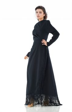 Add a little fun to your next night out with our Navy Fringe queen maxi dress. This sleek design will make you want to dance all night. Overlapping skirt features a ruched detail at the side, falling to an overlapping, tulip-style. The fabric in this dress is made from high quality polyester, unlined, perfect for cool nights. 58inch hand-wash polyester Elegant Draped Maxi Dress With Side Slits, Party Maxi Dress With Side Slits And Draped Style, Fitted Maxi Wrap Dress For Evening, Fitted Maxi Length Wrap Dress For Evening, Draped Ruched Maxi Skirt For Party, Evening Draped Ruched Maxi Dress, Evening Maxi Dress With Ruched Draped Design, Ruched Backless Maxi Dress For Night Out, Evening Full Length Ruched Maxi Dress