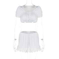 a white top and shorts set on a mannequin headdress with lace trims