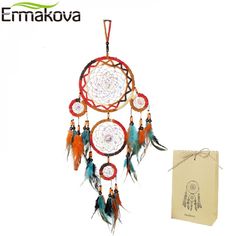 the dream catcher is next to its box and paper bag with an ornament on it