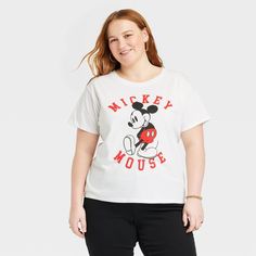 Add a bit of childhood nostalgia to your wardrobe with this Women's Disney Mickey Mouse Short Sleeve Graphic T-Shirt - White. The tee is made from soft material to keep you comfortable while you take on your day. It has a cute Mickey Mouse print for anyone who loves Disney or wants to give their day playful touch. Add a pinch of magic to your everyday wardrobe with this Women's Disney Mickey Mouse Short Sleeve Graphic T-Shirt - White. Playful Cotton Mickey Mouse T-shirt, Cotton Mickey Mouse Top With Relaxed Fit, Cotton Mickey Mouse Short Sleeve T-shirt, Mickey Mouse Graphic Tee With Short Sleeve, Mickey Mouse Cotton Short Sleeve T-shirt, Mickey Mouse Graphic Tee In Cotton, Mickey Mouse Graphic Cotton Tee, Mickey Mouse Graphic Tee With Crew Neck, Mickey Mouse Print