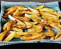 french fries are on a blue plate and ready to be cooked in the oven,