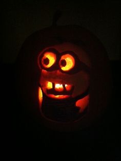 a carved pumpkin with glowing eyes and mouth