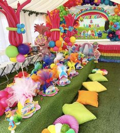 a colorful party with balloons, streamers and decorations