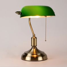 a green table lamp on a white background