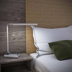 a lamp that is on top of a bed