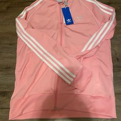 Gorgeous New With Tag Bubble Gum Pink Adidas Track Jacket With White Three Stripes. Youth Size Large. Matching Pants In Youth Size Medium Also For Sale In My Closet! Please Ask Any Questions. No Returns. Thank You! Trendy White Hooded Track Jacket, Adidas Long Sleeve Track Jacket With Pockets, Adidas Casual Track Jacket For Spring, Trendy Adidas Outerwear For Spring, Fitted Pink Casual Track Jacket, Pink Adidas Sports Outerwear, Adidas Long Sleeve Track Jacket For Spring, Adidas Long Sleeve Spring Track Jacket, Adidas White Outerwear For Spring